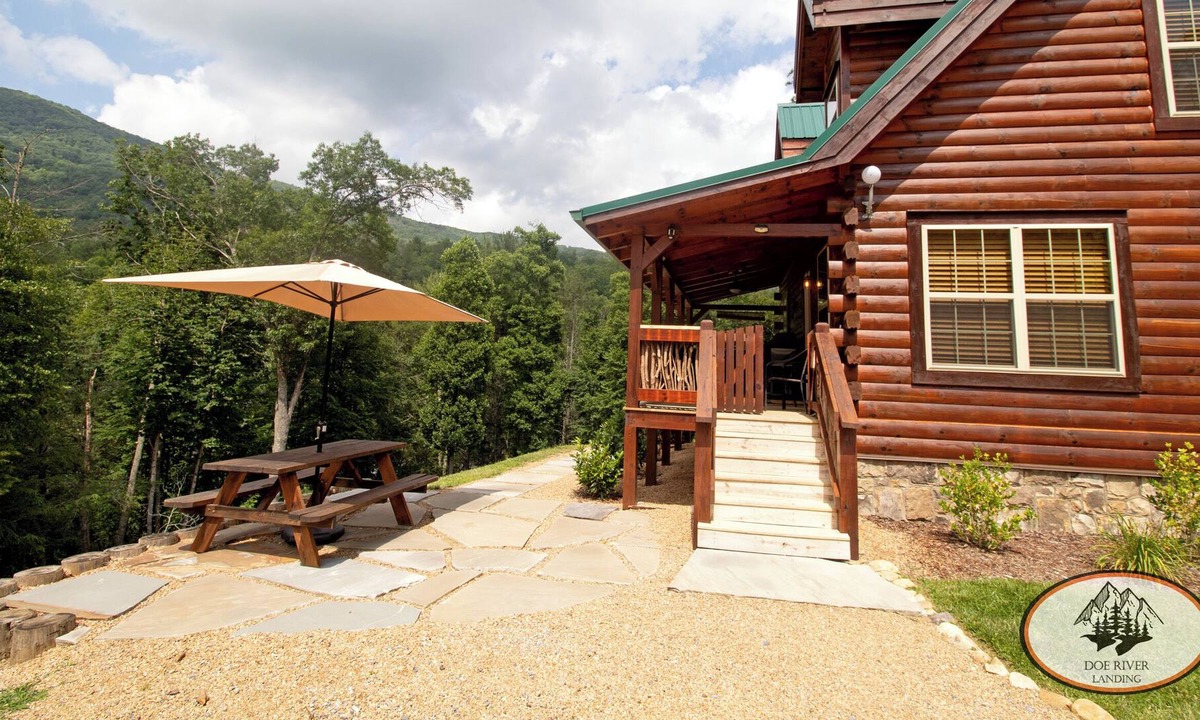 Roan Mountain Cabin | Experience the warm design and modern comfort of this gorgeous and private log cabin on Doe River