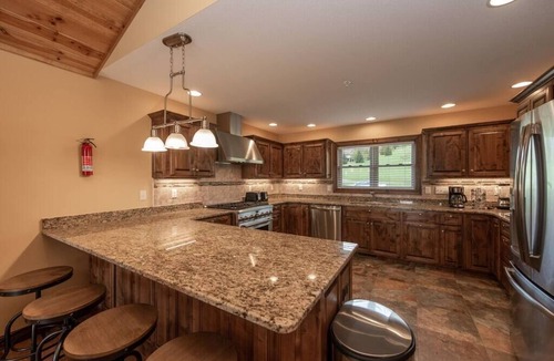 Waterfront Greens House | 6BR Luxury Escape w/Indoor Pool Boat Dock Avail