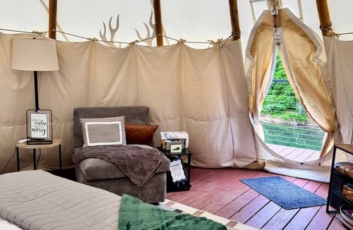 Farmers Resort | Buck Wild Teepee at The Edge—Unique Riverfront Glamping in Salt Lick, KY