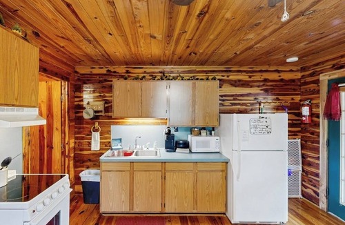 Mountain Pine Condo | Charming riverfront condo with river access for swimming, boating & fishing