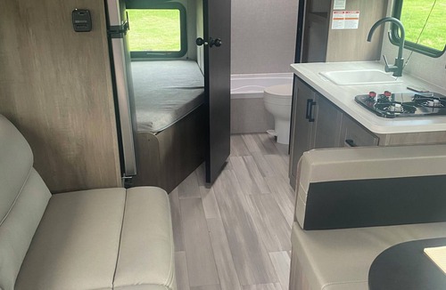 Keslers Cross Lanes RV Rental | Cozy 1-bedroom camper in tranquil setting with AC and heat. Sleeps 4.
