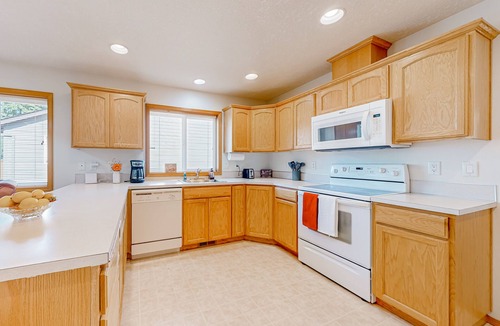 Gresham House | Custom-built home alongside greenspace with deck & massage chairs