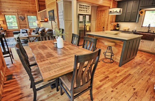 Warrensville Ski Chalet | Discover Moonshine River-a river front 4-bedroom cabin perfect for 8 guests!