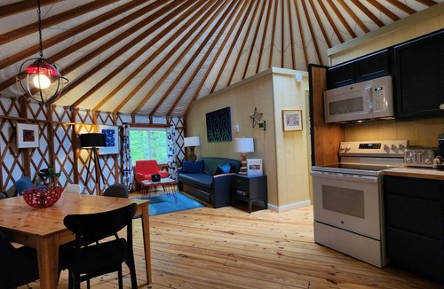 Mill Spring House | Dog friendly 30' Yurt, large dome skylight, king bed, 2 bedrooms, sleeps 6.