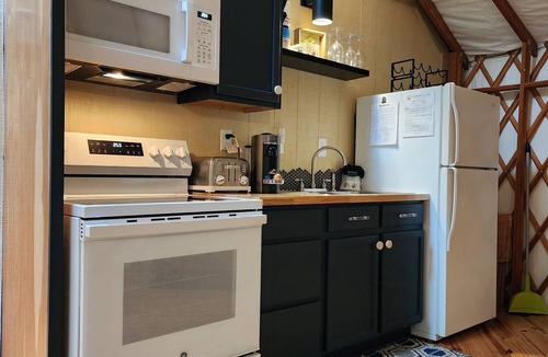 Mill Spring House | Dog friendly 30' Yurt, large dome skylight, king bed, 2 bedrooms, sleeps 6.