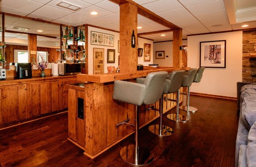 Asheville Apartment | Enjoy a beverage while viewing the Blue Ridge Mountains from the heated pool!