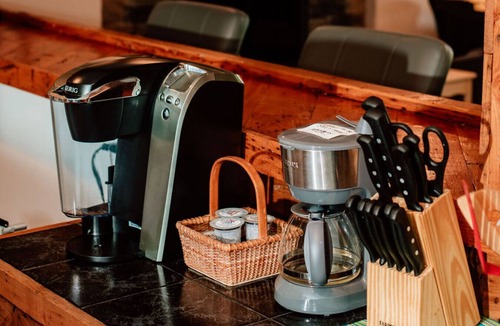 Asheville Apartment | Enjoy a beverage while viewing the Blue Ridge Mountains from the heated pool!