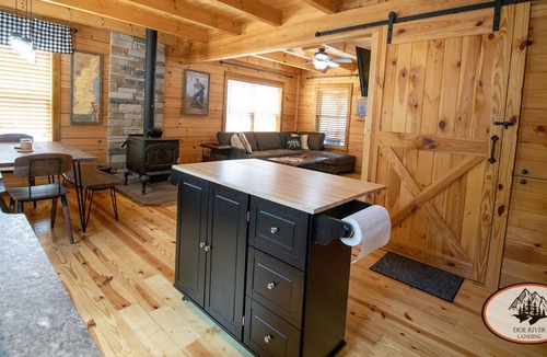 Roan Mountain Cabin | Experience the warm design and modern comfort of this gorgeous and private log cabin on Doe River