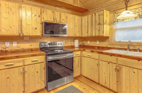 Boswell Cabin | Fire Pit, Screened Deck: Riverfront Ozarks Cabin!