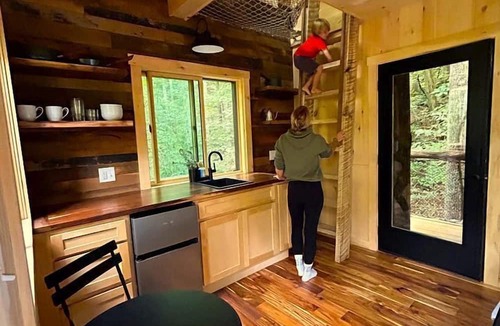 Zirconia Cabin | Magical Treehouse Stay with Creekside Sauna Experience in Zirconia, North Carolina