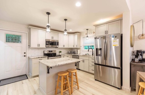 Newland House | Mill Timber Lodge: Creekfront home, dog friendly, firepit, yard, deck, WiFi & grill!