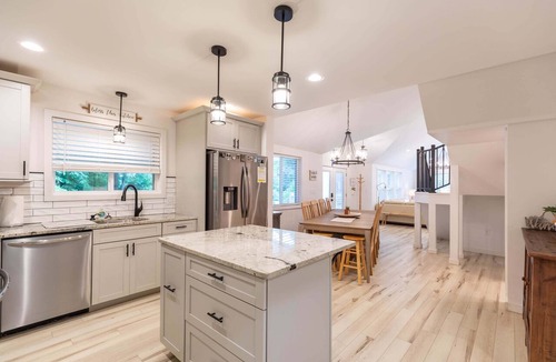 Newland House | Mill Timber Lodge: Creekfront home, dog friendly, firepit, yard, deck, WiFi & grill!