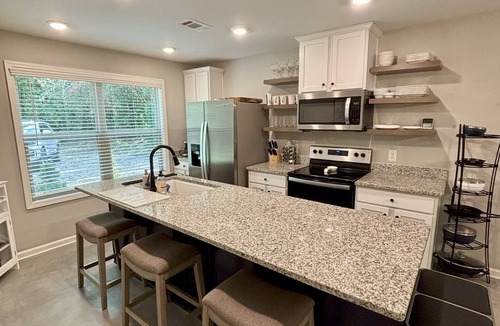 Rabun Gap House | Modern, 3/2 bed with fireplace, screened porch, & outdoor seating area.