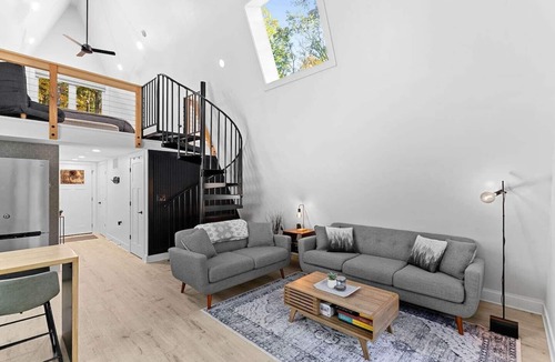 Great Cacapon Cabin | Modern Black A-frame retreat in the woods of Great Cacapon,WV - river access