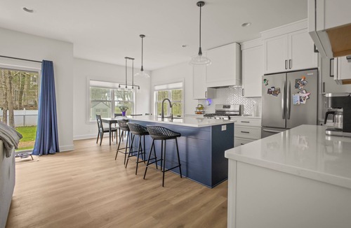 Malta House | Newly built, open-concept spacious home by the water. 10 minutes to the track.