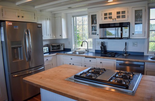 Dennis House | Rustic Oceanfront Retreat with Private Beach and Expansive Deck