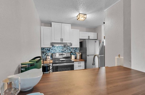 Winter Haven Condo | Waterfront Condo w/Pool access, Dock, Patio Views & 3 Miles from LEGOLAND