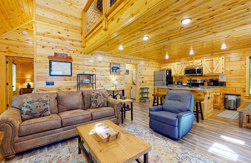 Chalet Village North Cabin | Wooded cabin w/hot tub, fireplaces, & furnished deck