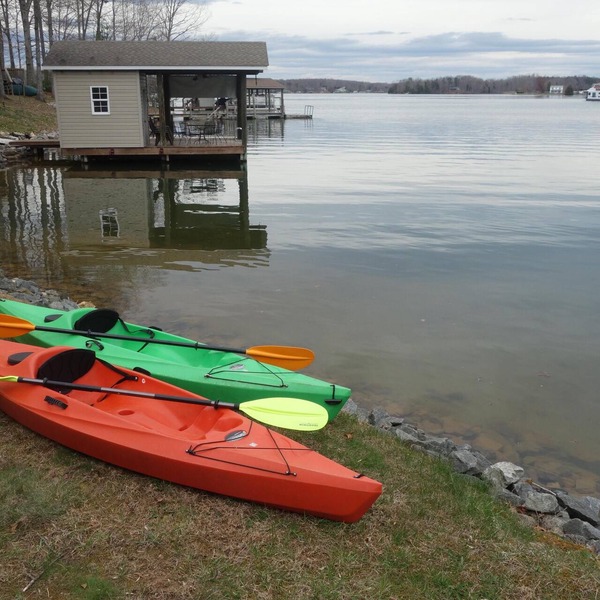 Power down as hot tub, kayaks, and pool table await, water "footsteps away".