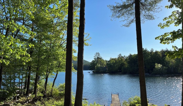 Charming lakefront 2-bedroom cottage with private beach & dock.