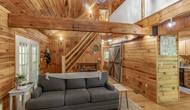Come relax in our cozy cottage nestled in the woods overlooking Lake Millie.