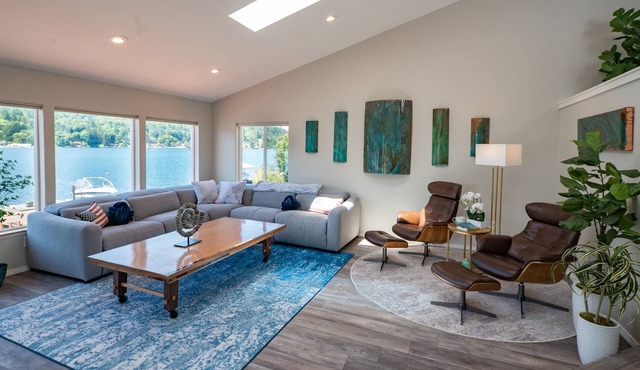 Inviting lakefront home with hot tub, game room, dock, kayaks, pool table, & W/D