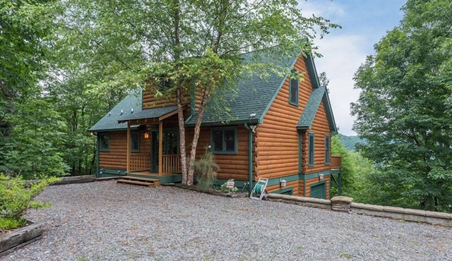 Larson Lookout | Log Cabin with Mountain Views & Hot Tub!