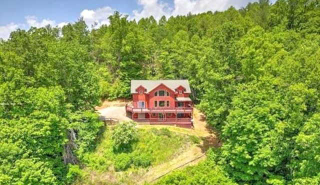 Still Waters Log Cabin Sits in a Mountain Lake Setting. Amazing Views!