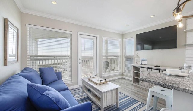 Trendy Beach Condo- Sunset views, Sandy Toes, Surfing more. (1304)